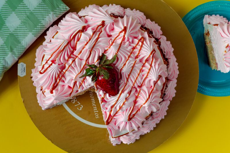 Tres leches cake with whipped cream and fresh berries